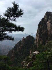 China Mount HuangShan - April, 2015: Natural scenery, sunsets, peculiarly-shaped granite peaks, Huangshan pine trees and views of the clouds from above. Photo taken in Yellow Mountain (UNESCO).