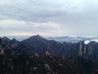China Mount HuangShan - April, 2015: Natural scenery, sunsets, peculiarly-shaped granite peaks, Huangshan pine trees and views of the clouds from above. Photo taken in Yellow Mountain (UNESCO).