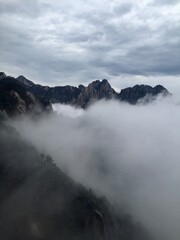 China Mount HuangShan - April, 2015: Natural scenery, sunsets, peculiarly-shaped granite peaks, Huangshan pine trees and views of the clouds from above. Photo taken in Yellow Mountain (UNESCO).