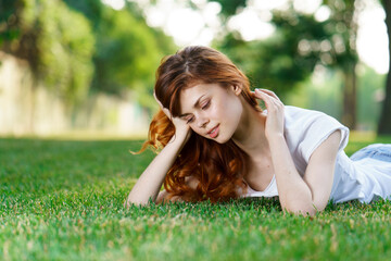 pretty woman lying on the lawn rest charm fresh air