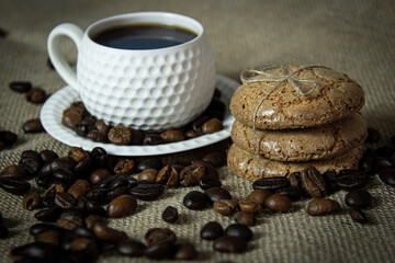 Coffee cup ,coffee beans and cookies.