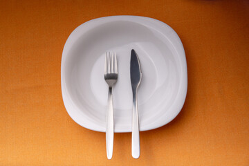 Dining etiquette - the meal is over or finished. Fork and knife signals with location of cutlery set