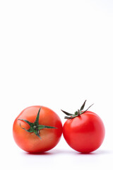 Closeup two fresh red tomatoes organic isolated on white background with copy space on top for writing text.