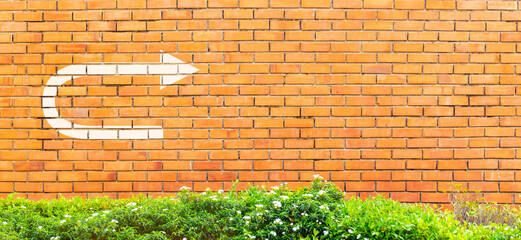 White turnaround sign or U tune sign on vintage brick wall, Decision making concept