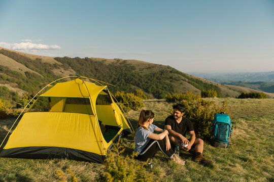 Young couple camping in mountain