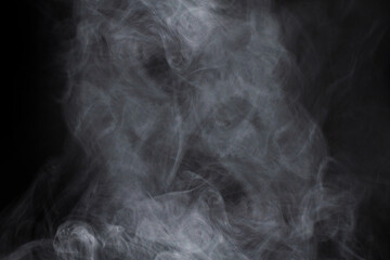White steam on a black background.