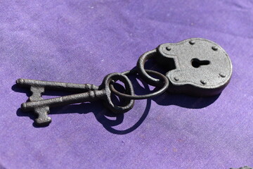 A restaurated old padlock with two keys.