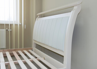 soft headboard of a wooden bed