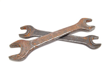 Rusty wrench on white background close-up. Tool, old, rare