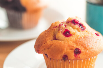 selective focus Blueberry muffins in a basket  baked blueberry muffins cooling with warm lighting 
