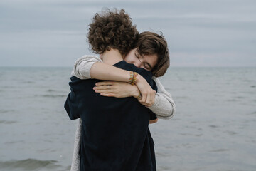 Couple Holding Each Other In The Beach
