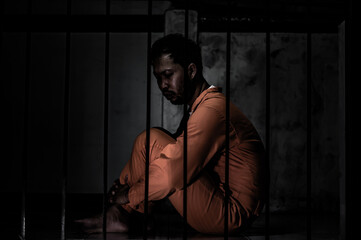 Asian man desperate at the iron prison,prisoner concept,thailand people,Hope to be free,Serious...
