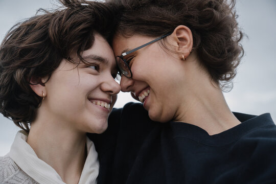 Non Binary Couple Looking Each Other