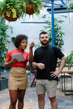 Event coordinator giving instructions to technician