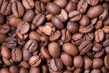 close up of Freshly roasted coffee beans background. top view