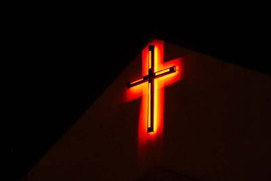 lonely red neon cross