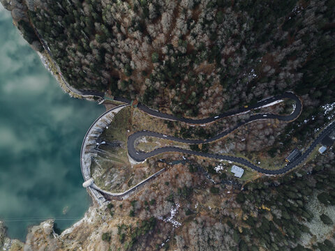 Winding road nearby mountain lake