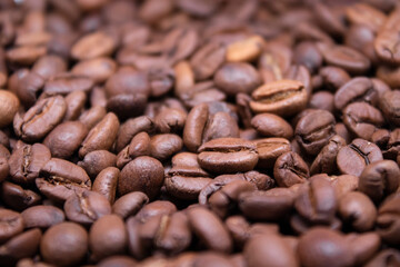 close up of Freshly roasted coffee beans background. top view