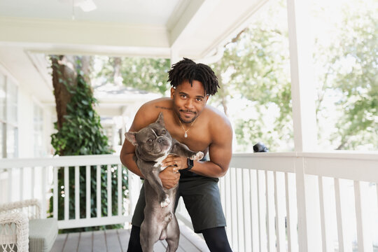 Man playing with dog.