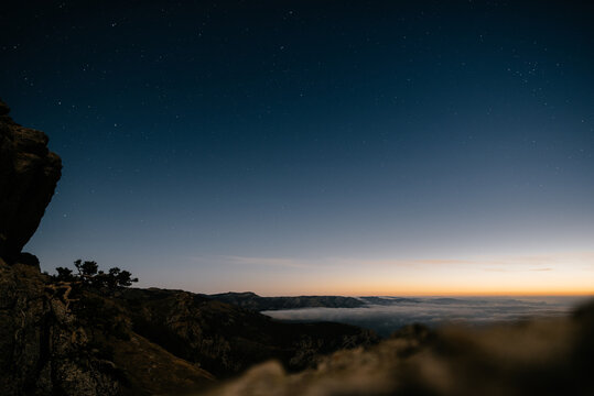 landscape with starry sky and first rays of the sun