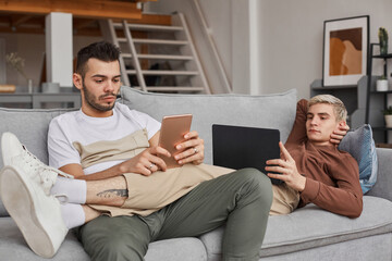 Two Young Men Relaxing on Couch