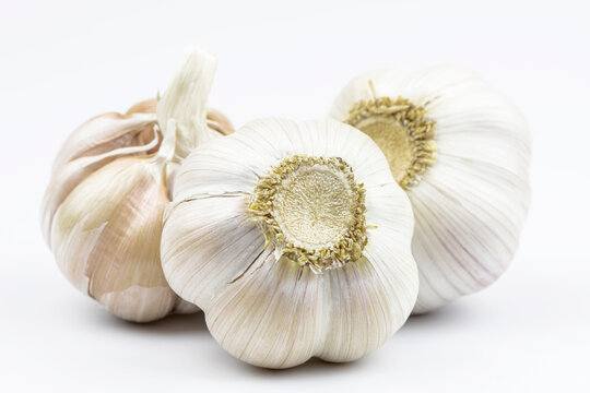 Heads of garlic by close up isolated on a white background.