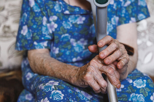 Fragile hands of elder woman