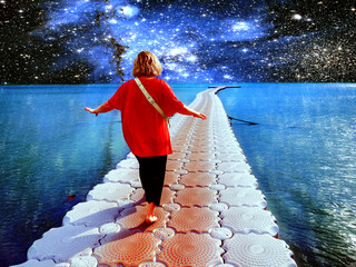 Surrealistic collage. A person walks along the ocean against the background of stars and galaxies