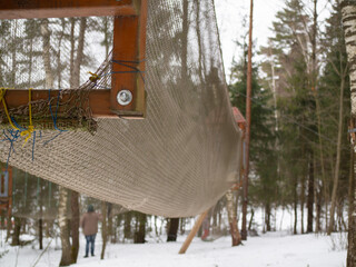 rope town. The attraction is a grid with obstacles between the trees.
