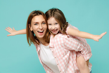 Happy woman in pink clothes have fun with child baby girl 5-6 years old Mommy little kid daughter...
