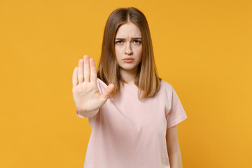 Young strict serious student protestive caucasian woman 20s in casual basic pastel pink t-shirt...