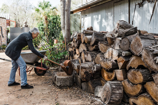 Woman splitting firewood