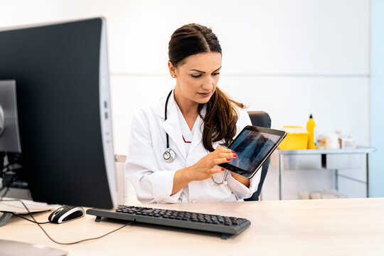 Female Doctor Using Tablet