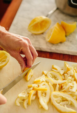 hand slicing lemon peel for marmalade