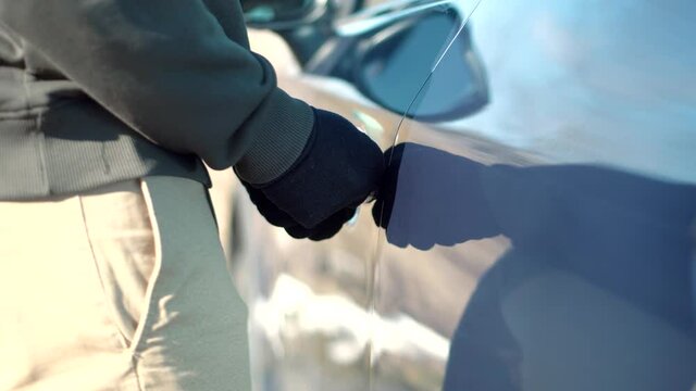 Vandalism Crime Theft Using Tool For Open Door.Thief Breaks Lock On Vehicle. Car Jacking Thief Steal Car Breaking Door. Criminal Bandit Job Burglar Hijacks Auto.Street Crime Violence Gangster Robber.