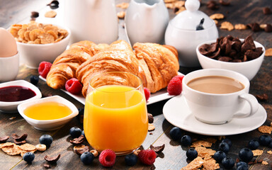Breakfast served with coffee, juice, croissants and fruits