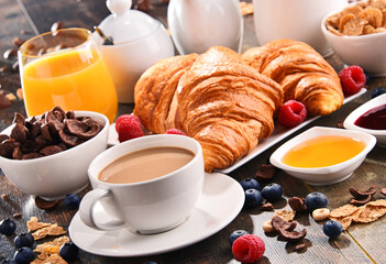 Breakfast served with coffee, juice, croissants and fruits