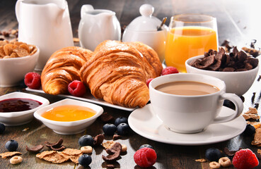 Breakfast served with coffee, juice, croissants and fruits