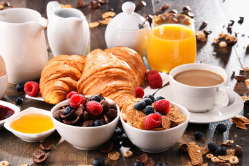 Breakfast served with coffee, juice, croissants and fruits