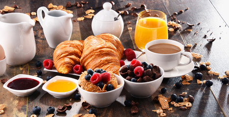 Breakfast served with coffee, juice, croissants and fruits