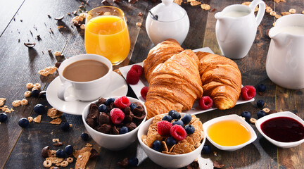 Breakfast served with coffee, juice, croissants and fruits