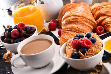 Breakfast served with coffee, juice, croissants and fruits