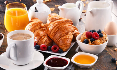 Breakfast served with coffee, juice, croissants and fruits