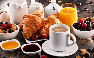 Breakfast served with coffee, juice, croissants and fruits