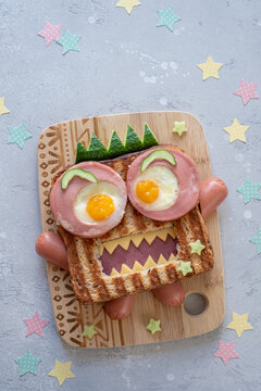 Halloween monster sandwich with slice meat ham, eggs and cheese