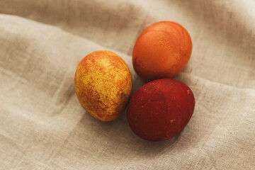 Modern simple red easter eggs on rustic linen cloth with space for text. Happy Easter! Aesthetic