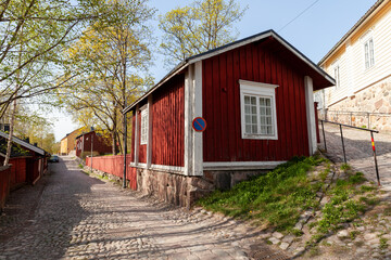 Fototapeta na wymiar Street view with red wooden Finnish houses