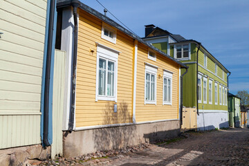 Fototapeta na wymiar Street view with colorful Finnish wooden houses