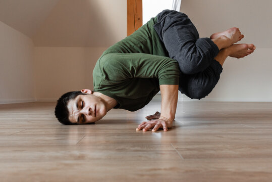 Young guy break dancing with closed eyes