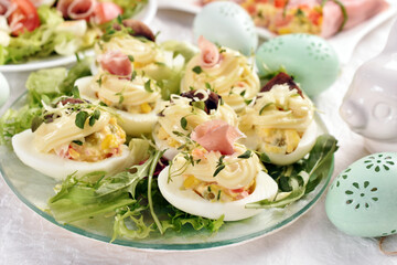 eggs with mayonnaise stuffed with vegetable salad on Easter table